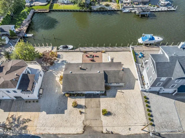 an aerial view of a house with lake view