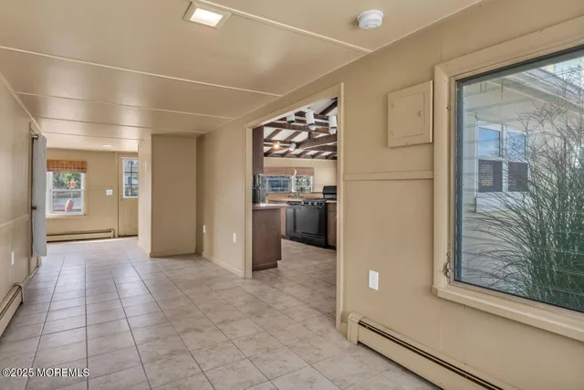 a view of a hallway with wooden shelves