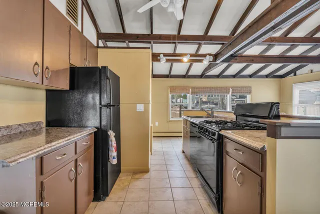 a kitchen with a stove and a refrigerator