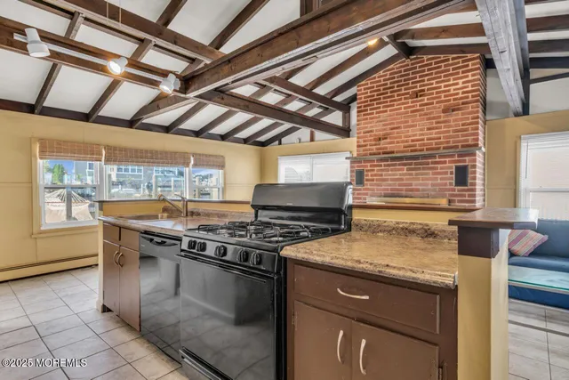 a kitchen with a stove and a sink