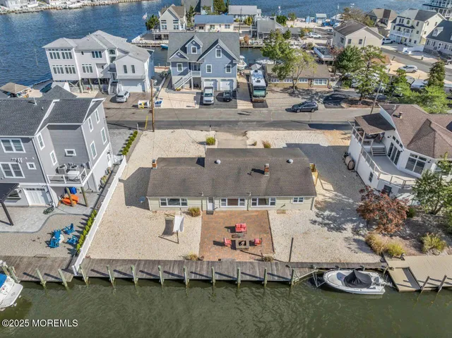 an aerial view of a house with outdoor space