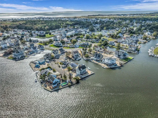 an aerial view of a house with a ocean view