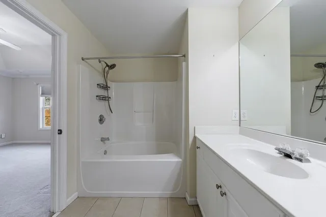 a bathroom with a bathtub and a sink