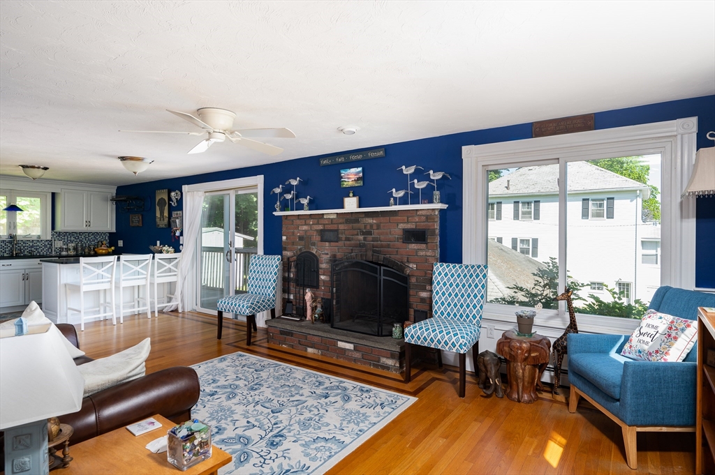 29 Wituwamat Road Weymouth, MA 02191 - Photo 7 of 42 a living room with furniture and a fireplace