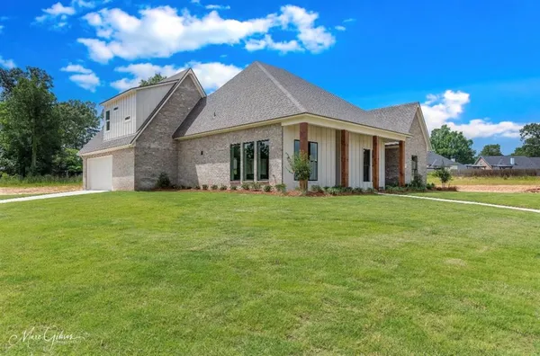 a front view of house with an outdoor space and seating