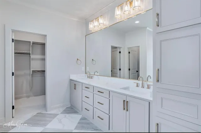 a spacious bathroom with a double vanity sink mirror and double