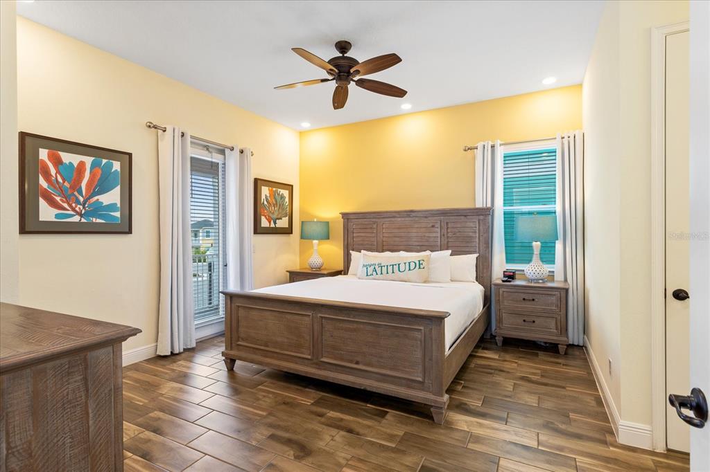 8063 Knee Deep Road Kissimmee, FL 34747 - Photo 12 of 24 a bedroom with a bed and a painting on the wall