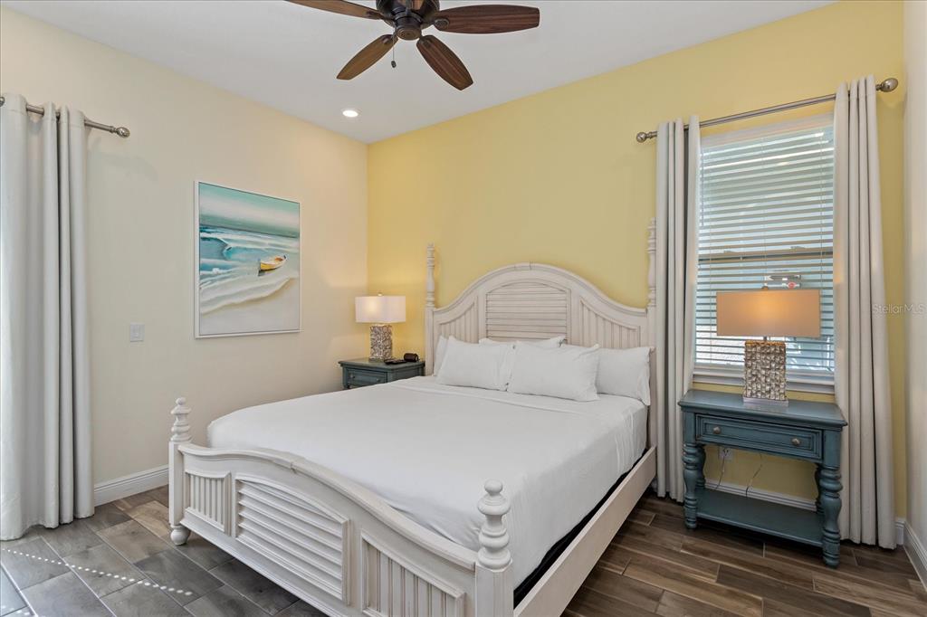 8063 Knee Deep Road Kissimmee, FL 34747 - Photo 16 of 24 a bedroom with a bed and a chandelier