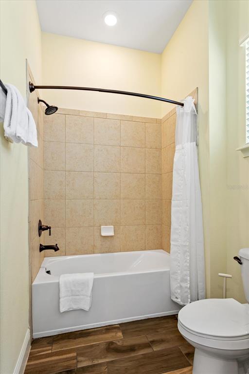 8063 Knee Deep Road Kissimmee, FL 34747 - Photo 9 of 24 a bathroom with a shower and a toilet
