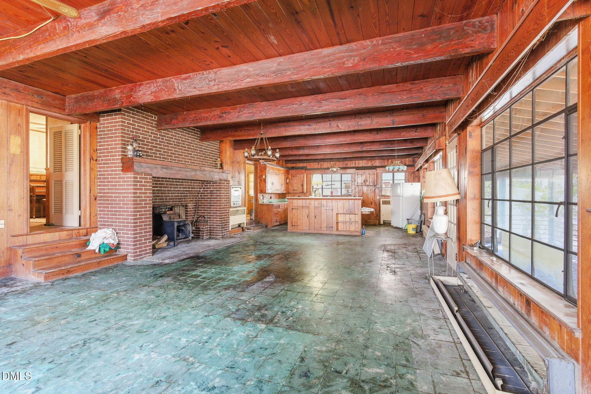 1603 Sykes Road Mebane, NC 27302 - Photo 5 of 45 a view of empty room with wooden floor and fireplace