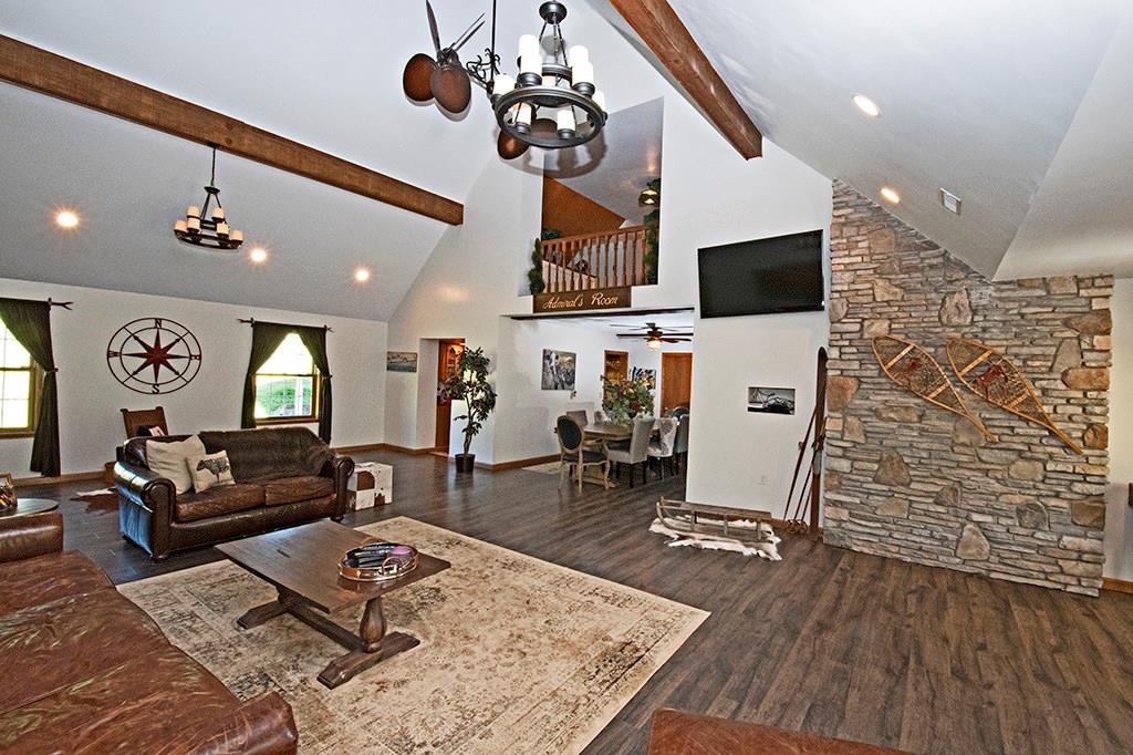 104 Rea Road Avella, PA 15312 - Photo 2 of 25 THE HUGE FAMILY ROOM PROVIDES A PLACE TO RELAX. CATHEDRAL CEILING & WOOD BEAMS.