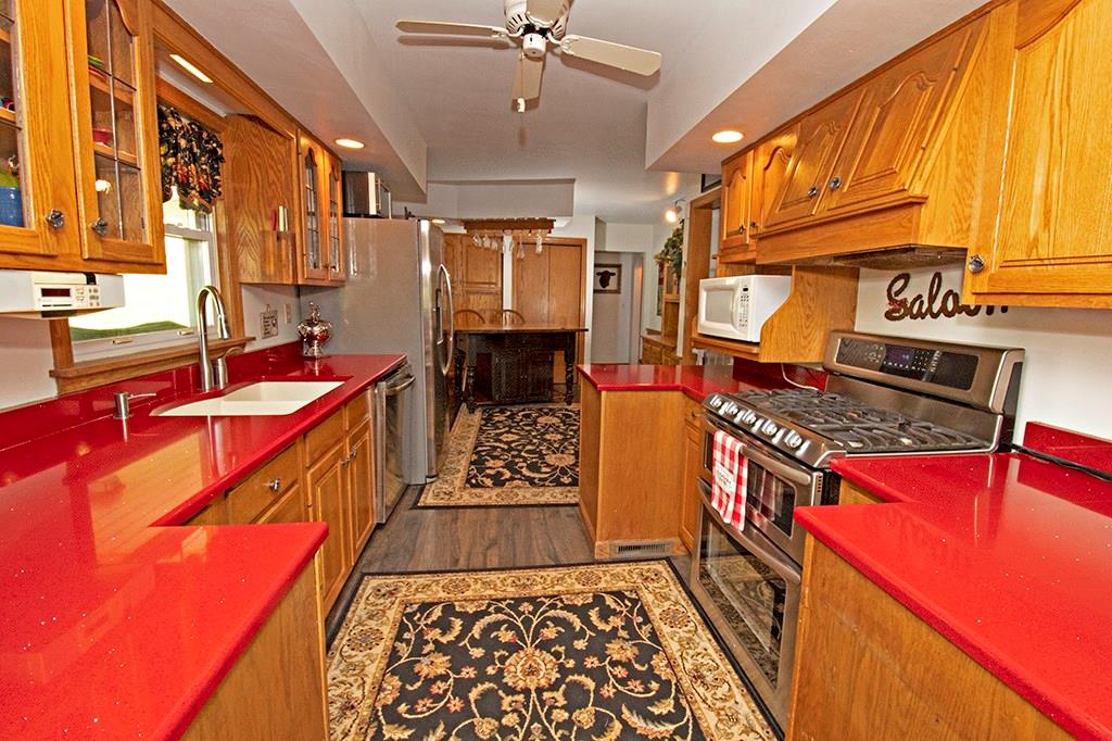104 Rea Road Avella, PA 15312 - Photo 6 of 25 A DELIGHTFUL AND CHEERY KITCHEN FOR MEAL PREP! STAINLESS STEEL APPLIANCES, AMPLE STORAGE AND PREP SPACE FOR DOWN HOME COOKING!