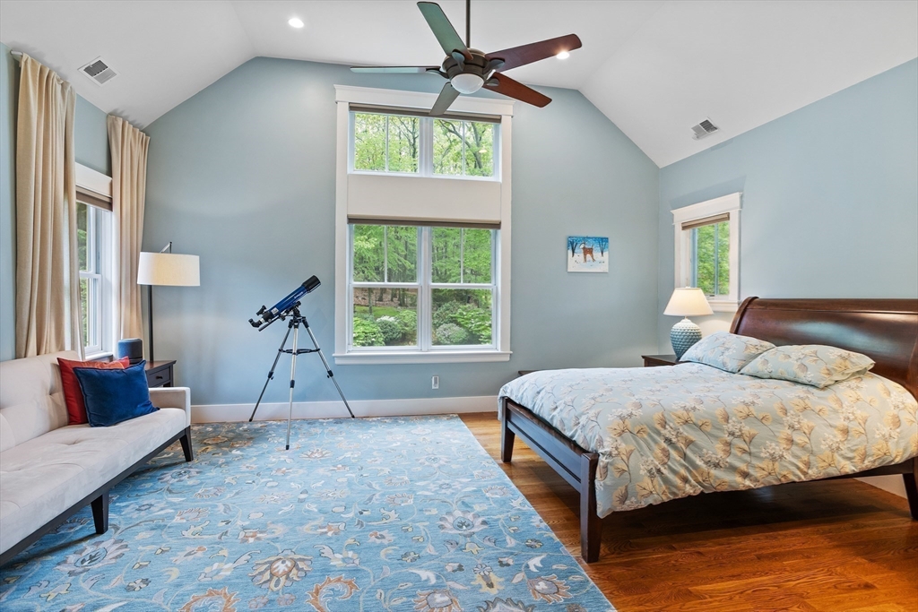 5 Walnut Street Lexington, MA 02421 - Photo 16 of 34 a bedroom with a bed and a couch