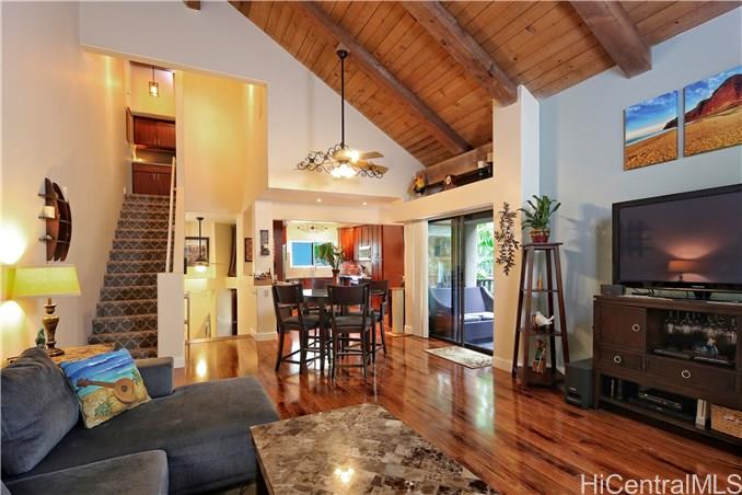 46-359 Haiku Road, Unit A6 Kaneohe, HI 96744 - Photo 1 of 1 a living room with furniture and a flat screen tv