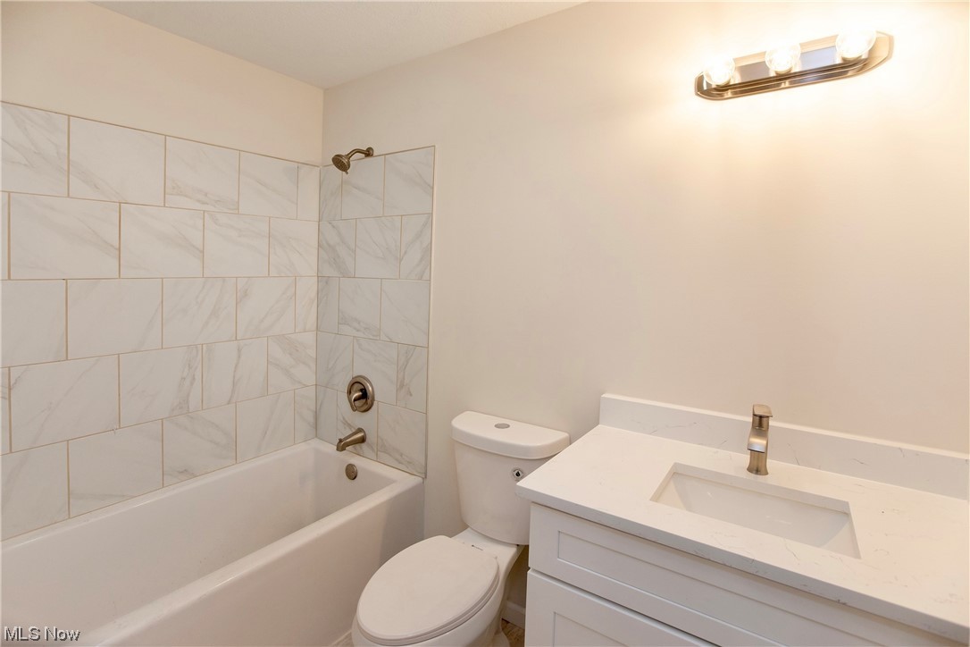 5461 Lear Nagle Road North Ridgeville, OH 44039 - Photo 12 of 26 2nd Full bathroom with toilet, tiled shower / bath, and vanity