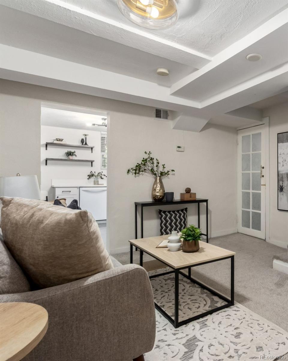 1284 Columbine Street, Unit 2 Denver, CO 80206 - Photo 13 of 34 a living room with furniture and a window