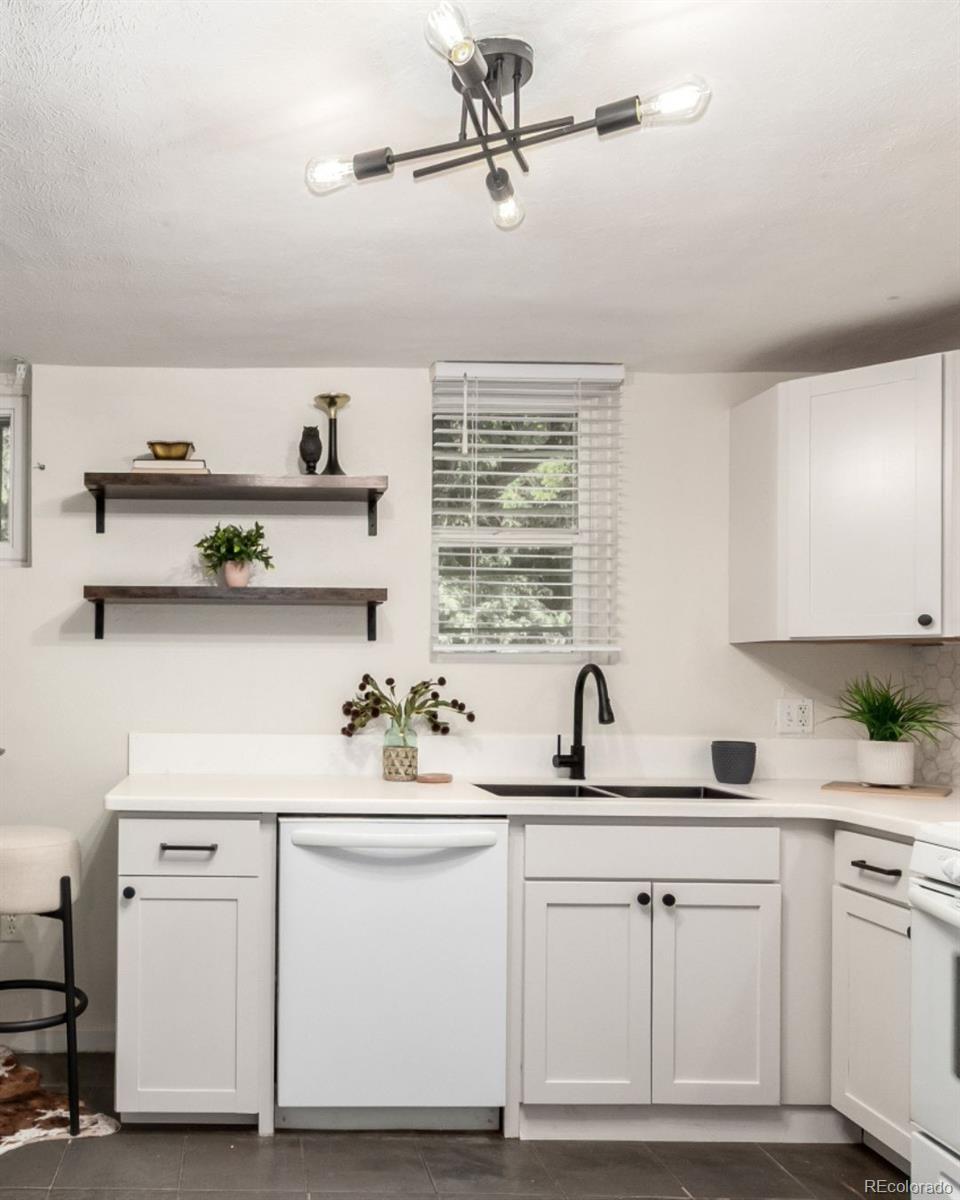 1284 Columbine Street, Unit 2 Denver, CO 80206 - Photo 14 of 34 a kitchen with white cabinets and sink