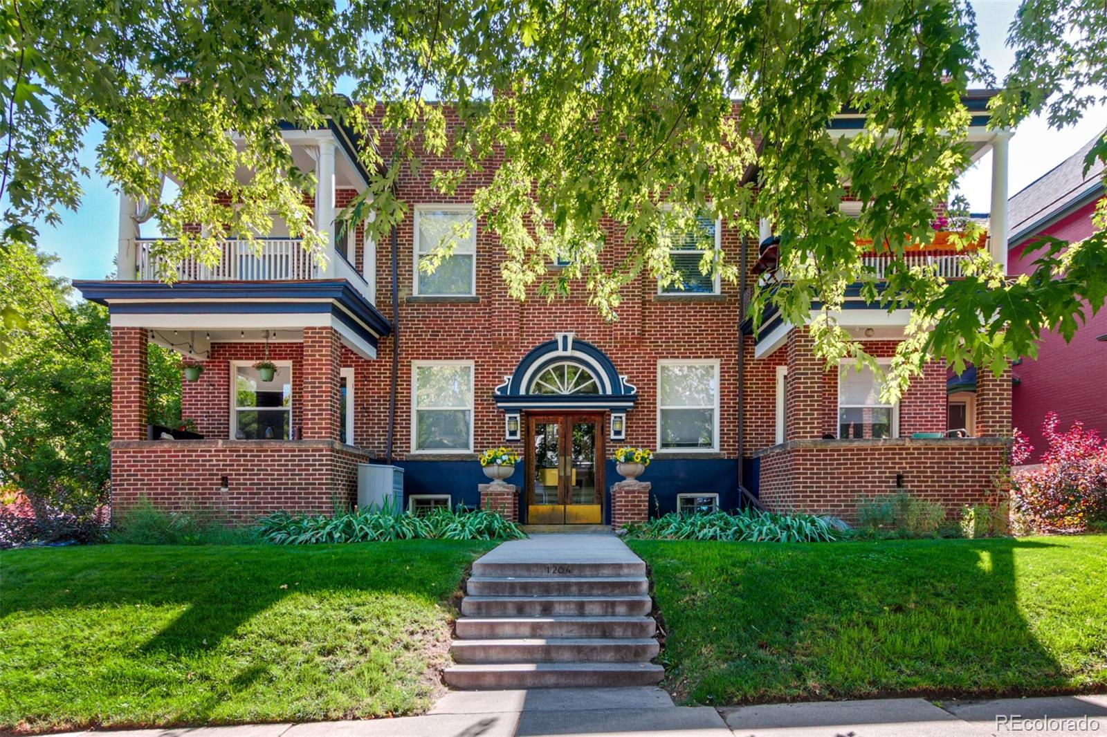 1284 Columbine Street, Unit 2 Denver, CO 80206 - Photo 19 of 34 a front view of a house with garden