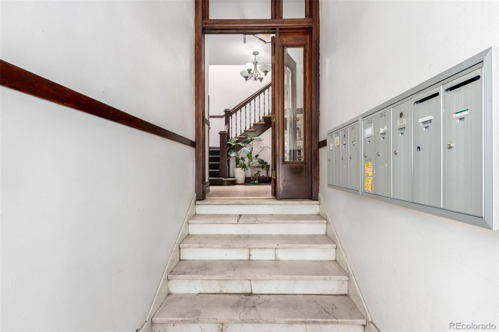 1284 Columbine Street, Unit 2 Denver, CO 80206 - Photo 21 of 34 a view of staircase with white walls and white walls