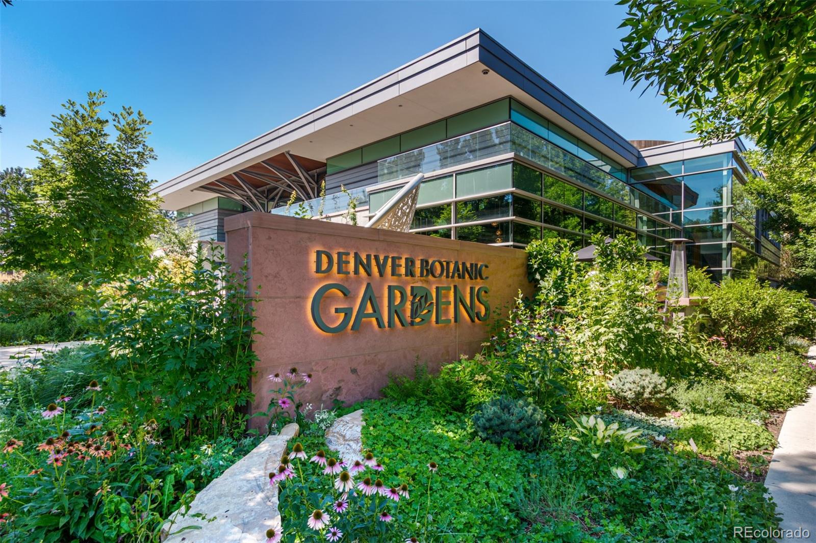 1284 Columbine Street, Unit 2 Denver, CO 80206 - Photo 24 of 34 a sign that is sitting on a wooden wall