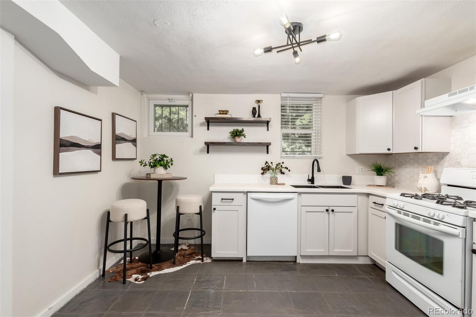 1284 Columbine Street, Unit 2 Denver, CO 80206 - Photo 4 of 34 a kitchen with a sink cabinets and window