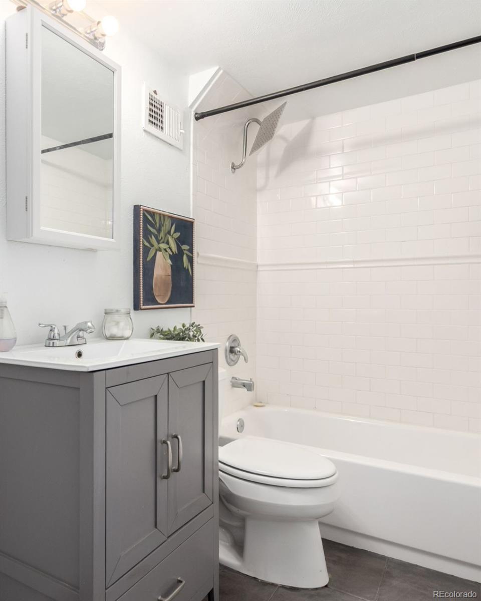 1284 Columbine Street, Unit 2 Denver, CO 80206 - Photo 7 of 34 a bathroom with a sink a toilet and a bathtub