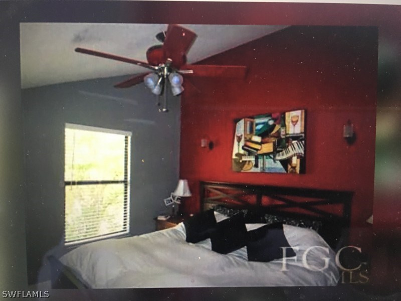 7489 Pebble Beach Road Fort Myers, FL 33967 - Photo 3 of 7 a bedroom with a bed and a window