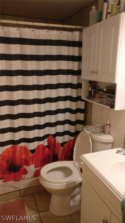 7489 Pebble Beach Road Fort Myers, FL 33967 - Photo 5 of 7 a bathroom with a toilet and a sink