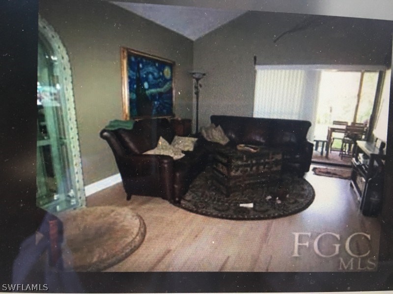 7489 Pebble Beach Road Fort Myers, FL 33967 - Photo 6 of 7 a living room with furniture
