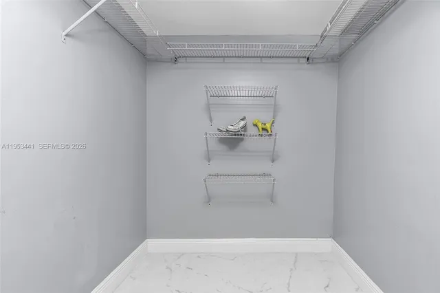 a room with a bed and a mirror