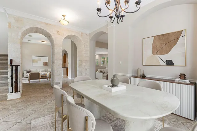 a spacious bedroom with a bed and a large window