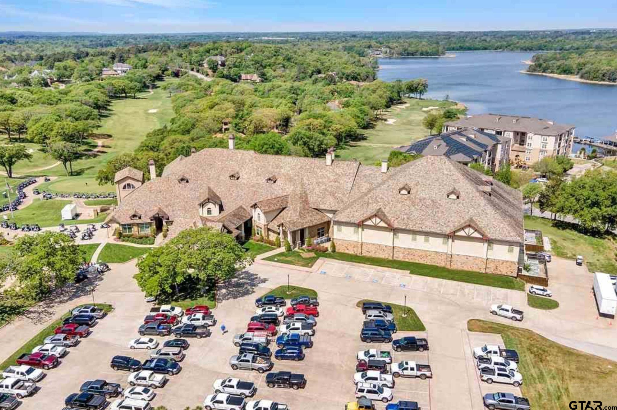4856 Nicklaus Court Tyler, TX 75709 - Photo 19 of 32 an aerial view of a house with a garden