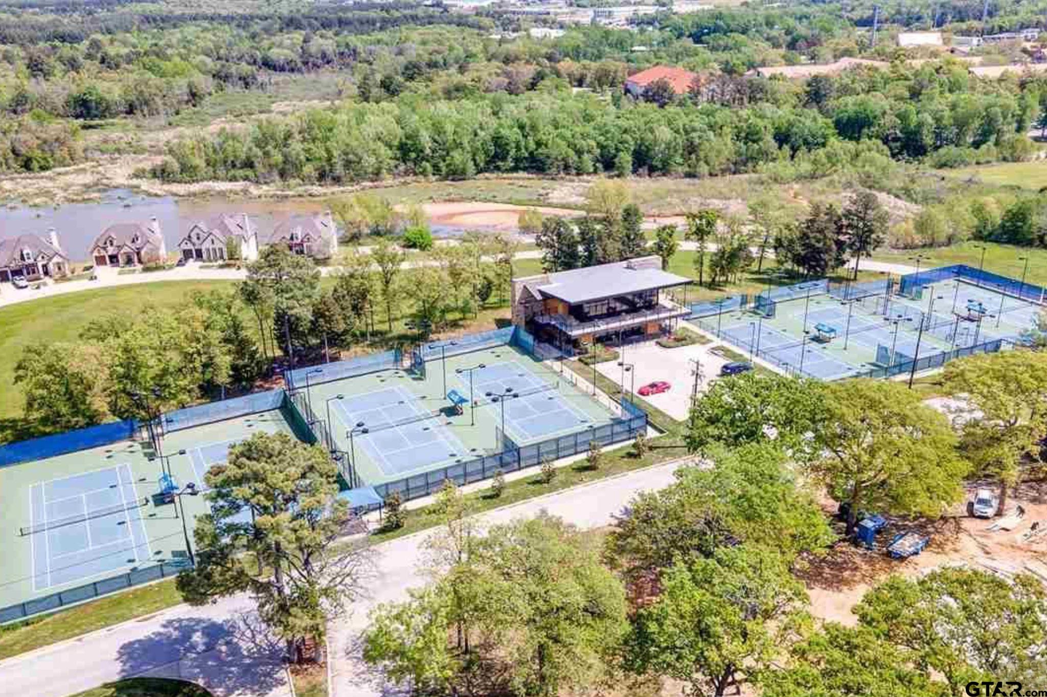4856 Nicklaus Court Tyler, TX 75709 - Photo 20 of 32 an aerial view of a house with a yard