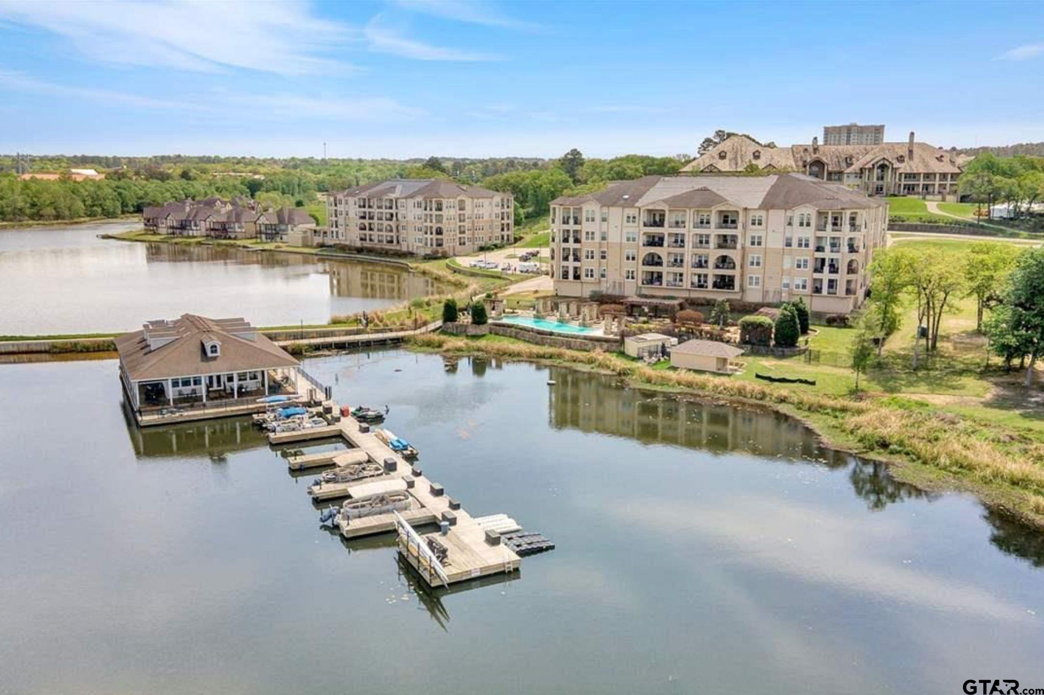 4856 Nicklaus Court Tyler, TX 75709 - Photo 23 of 32 a view of a lake with houses on the terrace