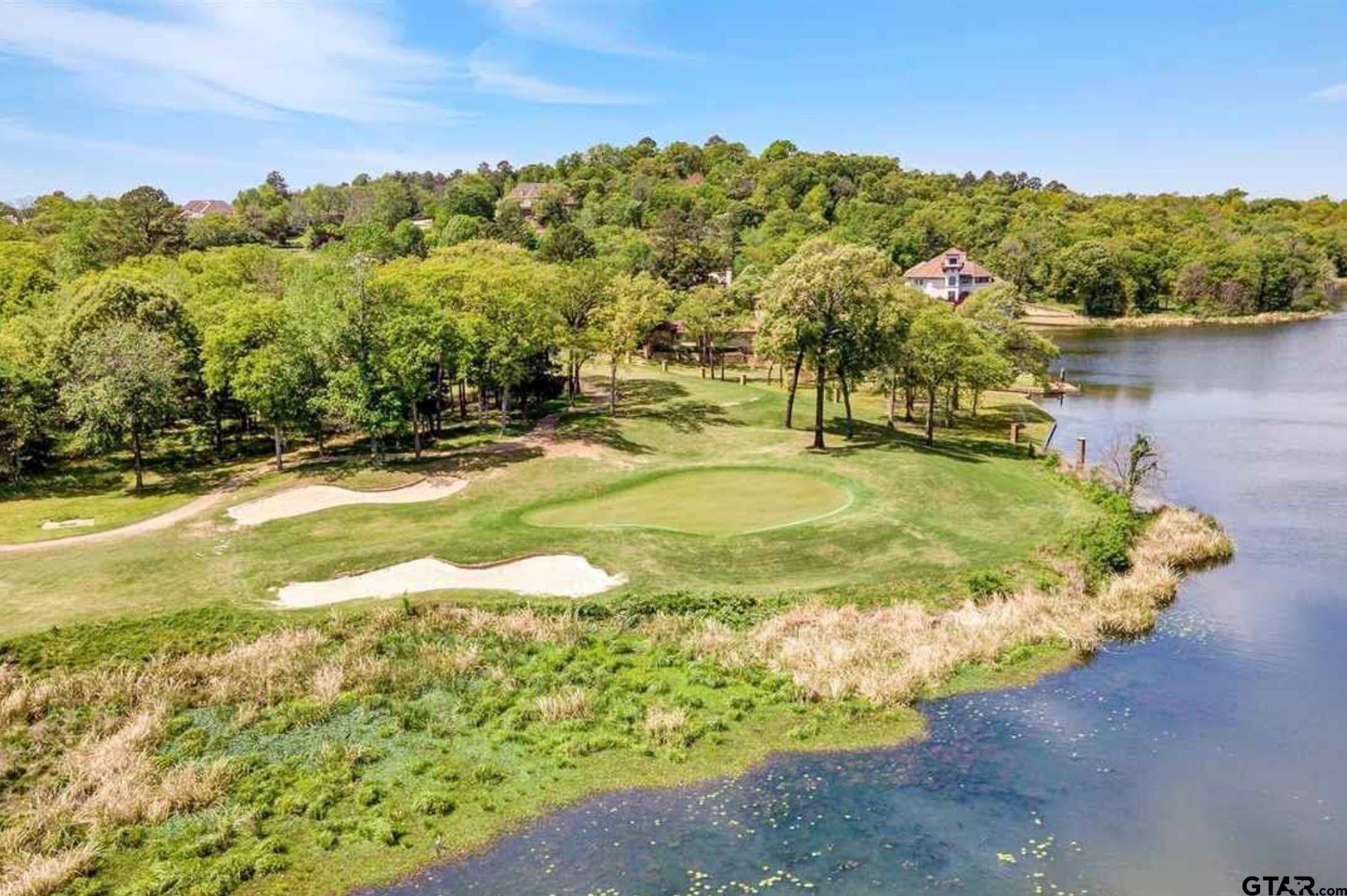 4856 Nicklaus Court Tyler, TX 75709 - Photo 28 of 32 a view of a swimming pool with an outdoor space and seating area