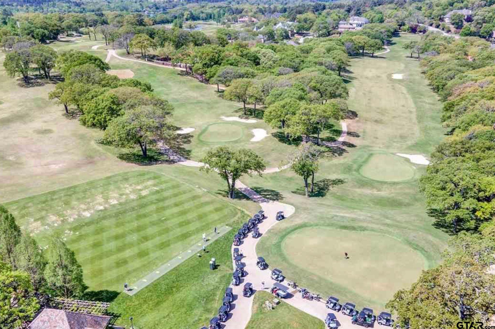 4856 Nicklaus Court Tyler, TX 75709 - Photo 31 of 32 a bathroom with a sink and mirror