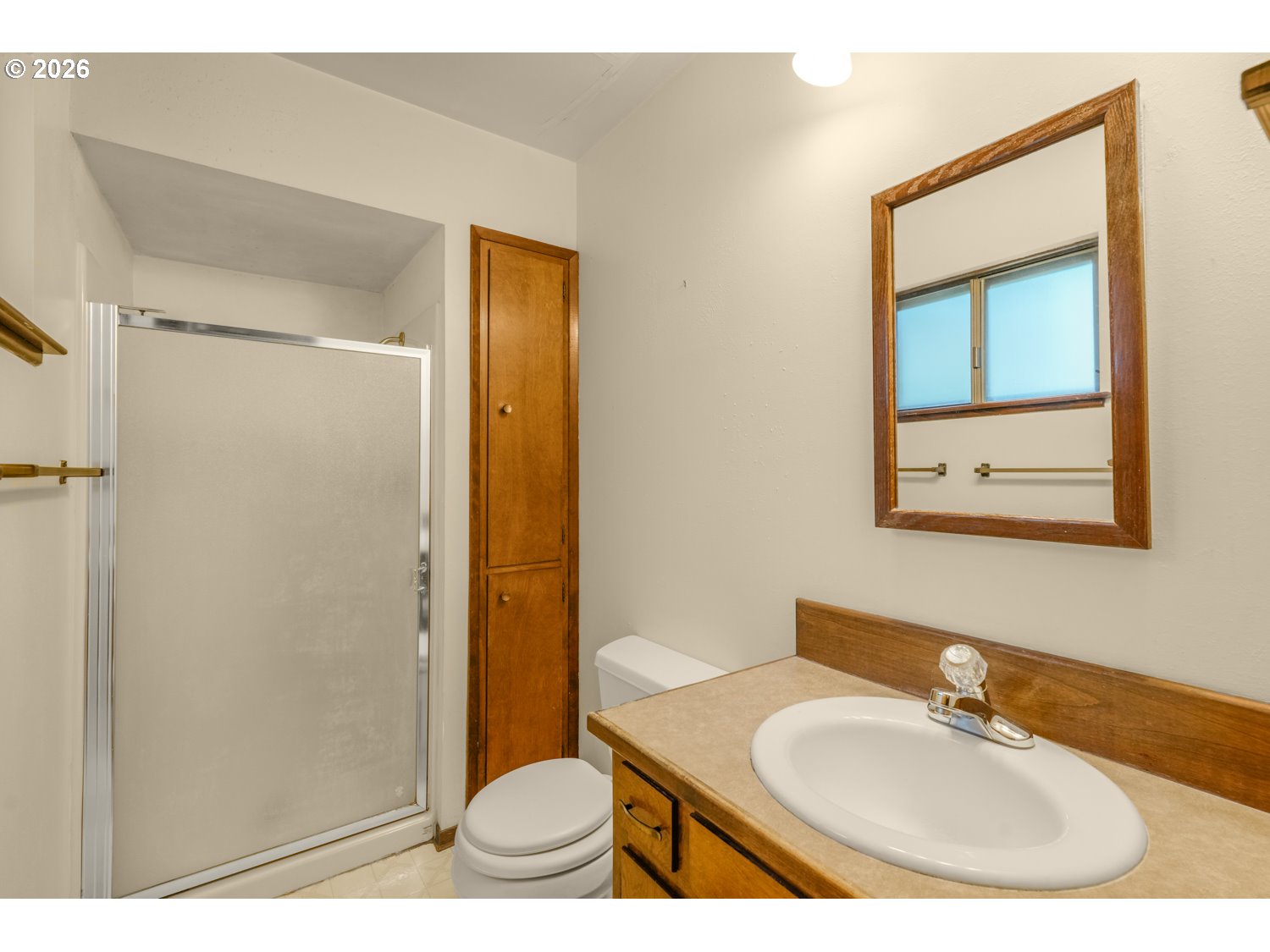 14155 Southwest 27th Street Beaverton, OR 97008 - Photo 20 of 27 a bathroom with a sink and a mirror