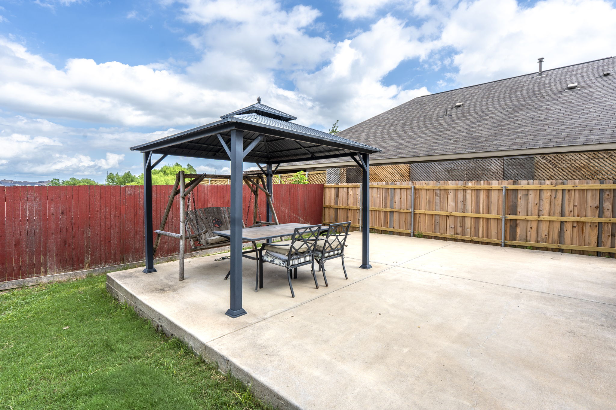 373 Rough Bark Street Buda, TX 78610 - Photo 25 of 39 A spacious backyard patio provides an ideal setting for outdoor enjoyment.