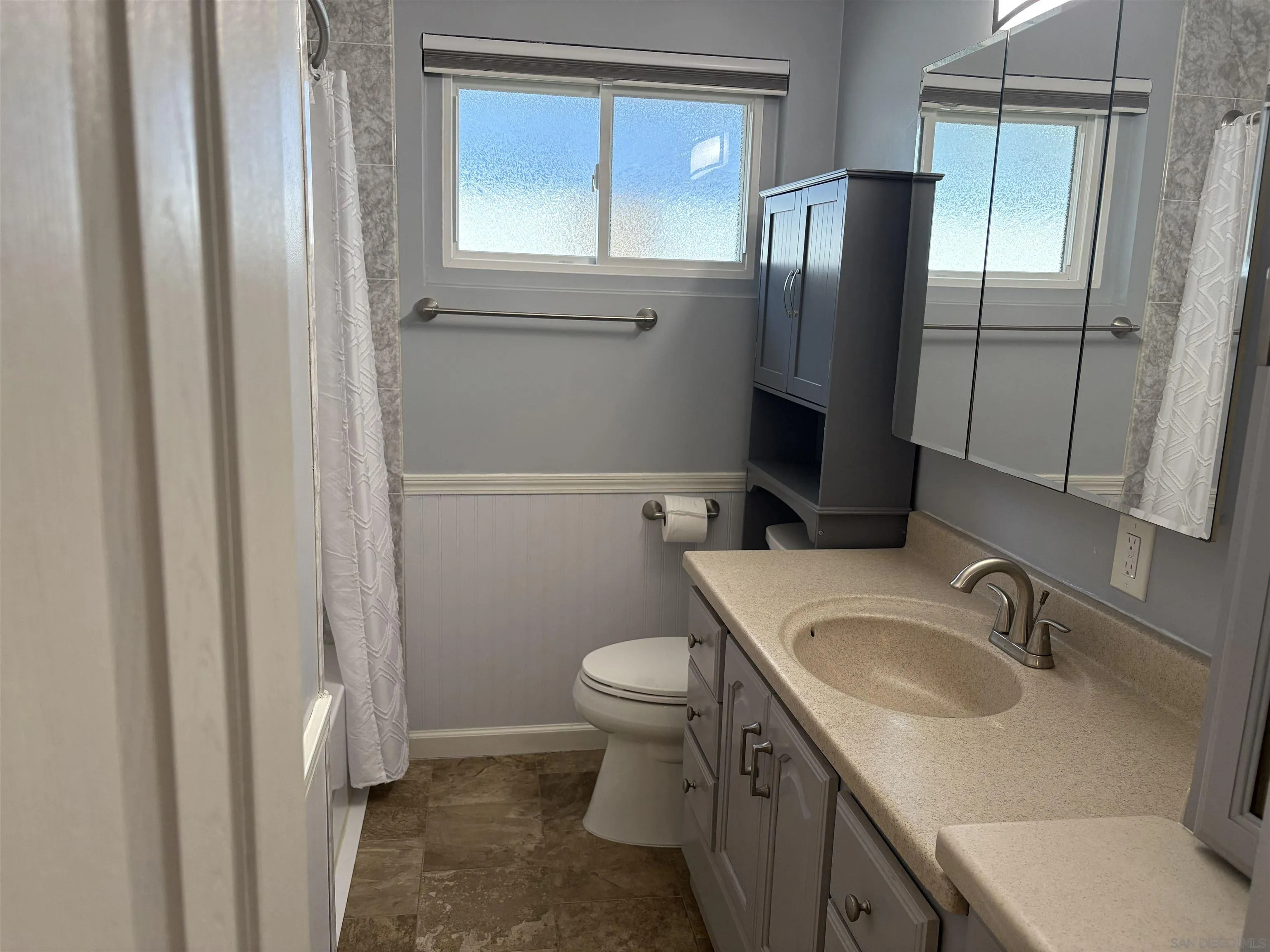 4160 Yale Avenue La Mesa, CA 91941 - Photo 12 of 18 a bathroom with a sink toilet and shower