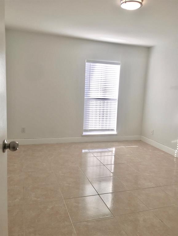 927 Riverside Drive, Unit 335 Coral Springs, FL 33071 - Photo 14 of 23 a view of an empty room with a window