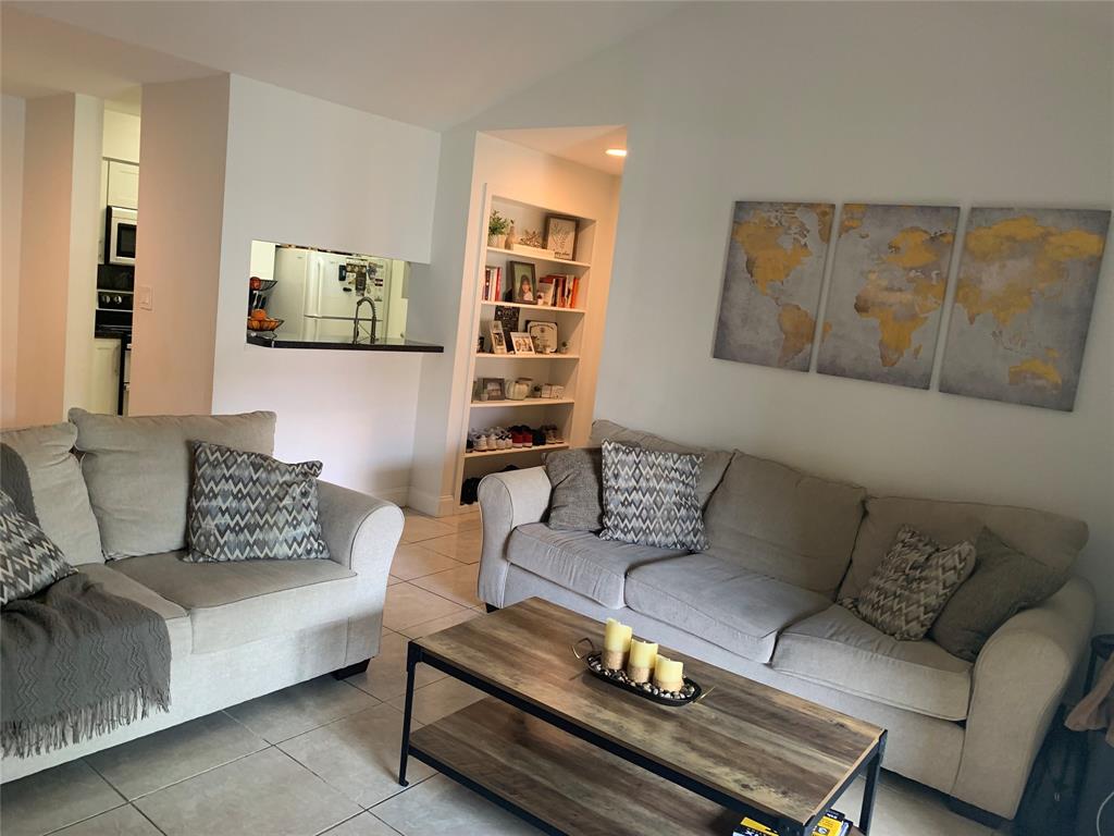 927 Riverside Drive, Unit 335 Coral Springs, FL 33071 - Photo 22 of 23 a living room with furniture