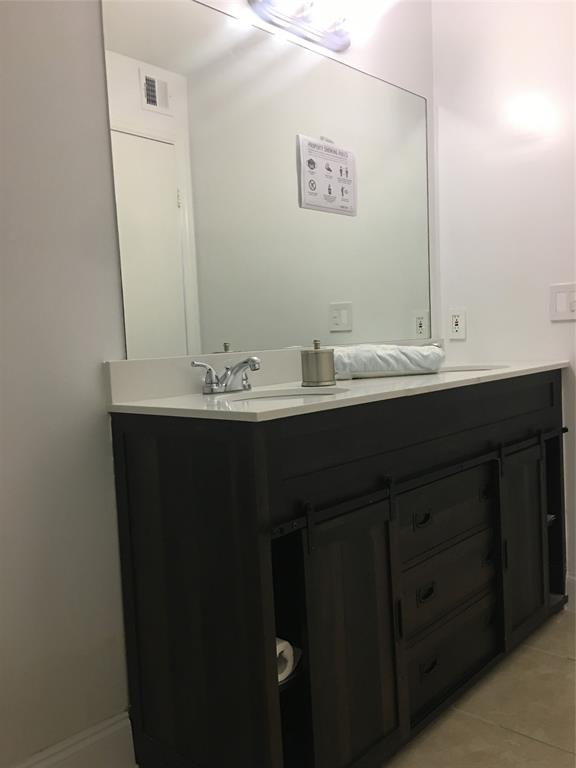 927 Riverside Drive, Unit 335 Coral Springs, FL 33071 - Photo 7 of 23 a bathroom with a sink and a mirror