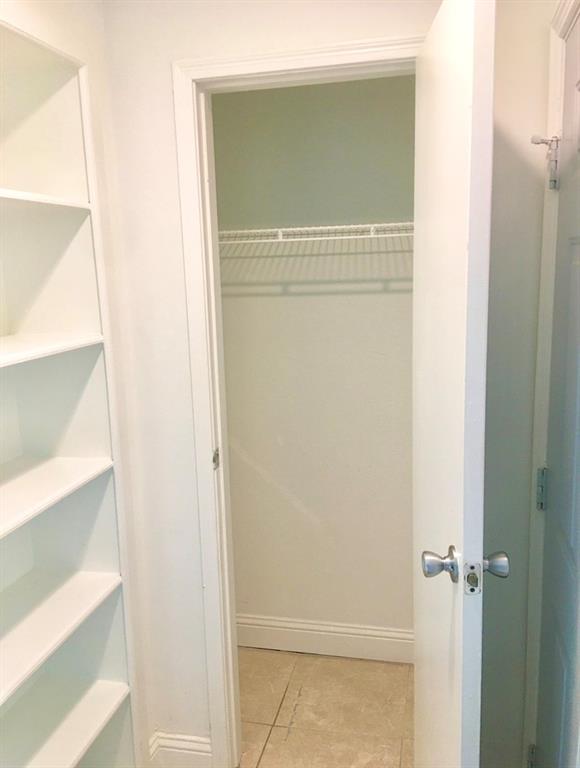 927 Riverside Drive, Unit 335 Coral Springs, FL 33071 - Photo 8 of 23 a bathroom with a glass shower door