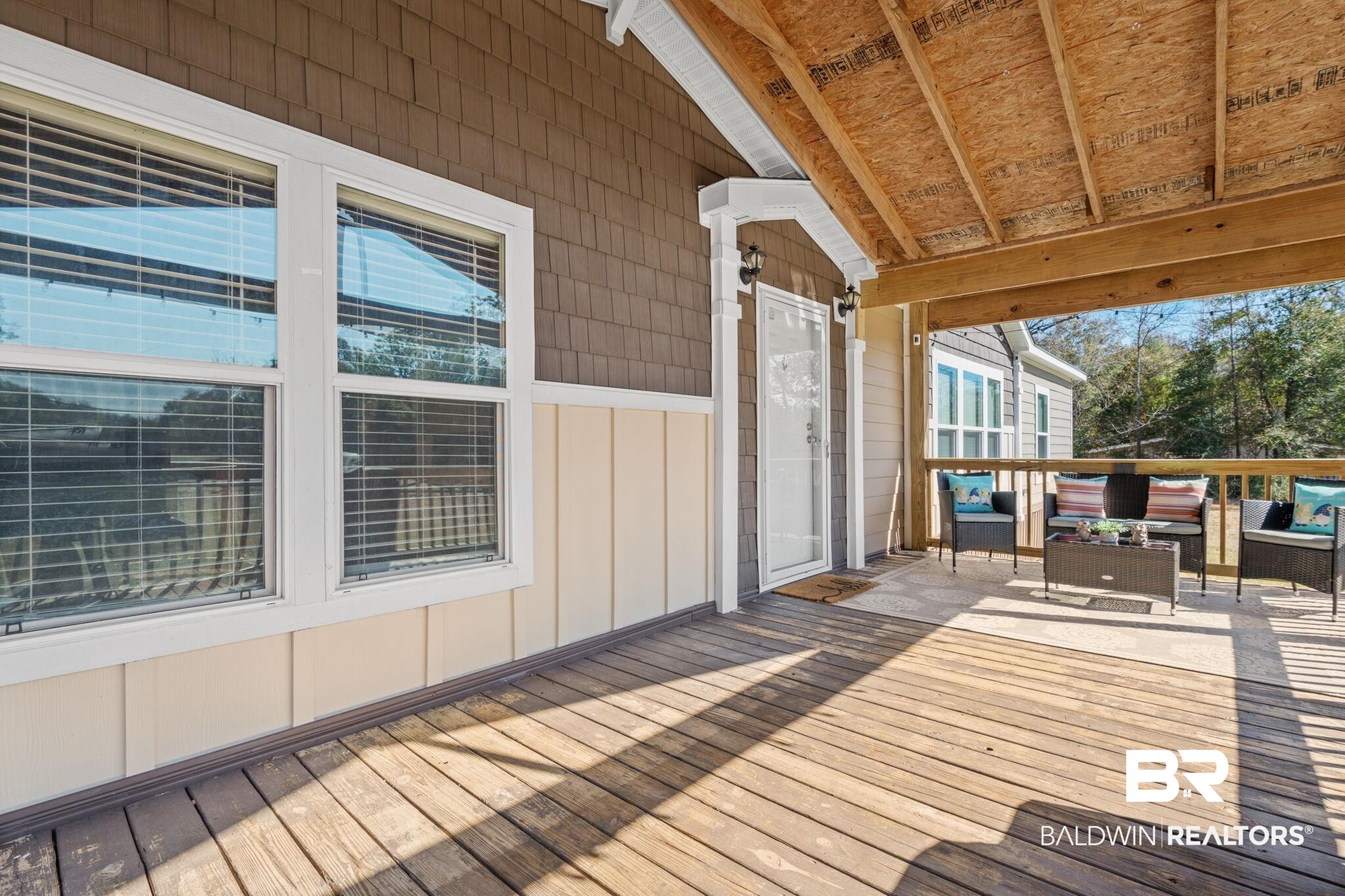15080 Starlight Avenue Wilmer, AL 36587 - Photo 5 of 29 Wooden terrace with an outdoor hangout area