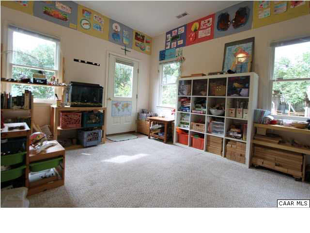 129 Goodman Street Charlottesville, VA 22902 - Photo 12 of 25 a living room with furniture window and a flat screen tv
