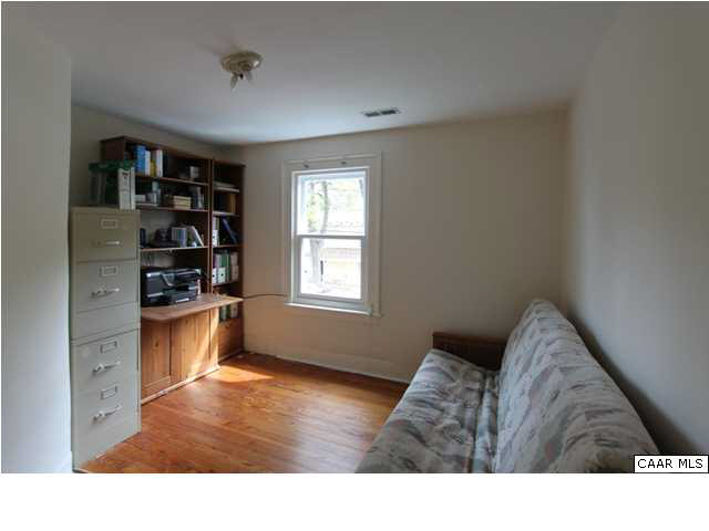 129 Goodman Street Charlottesville, VA 22902 - Photo 13 of 25 a living room with furniture and window