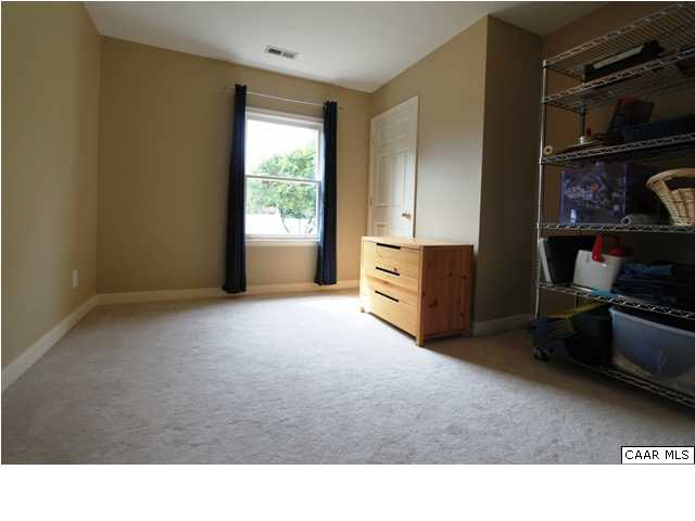129 Goodman Street Charlottesville, VA 22902 - Photo 15 of 25 a room with furniture and a flat tv screen