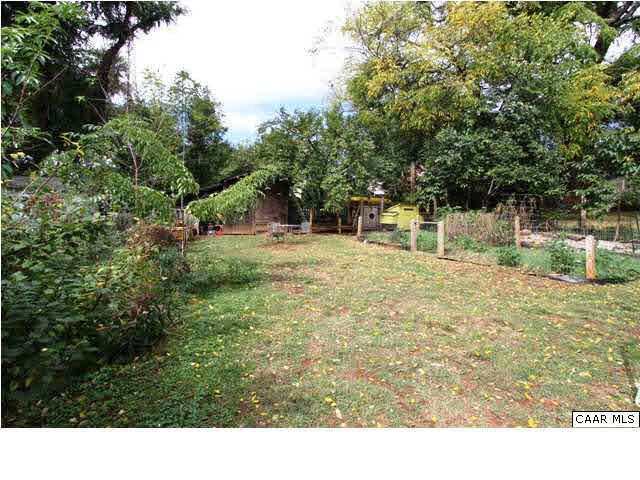 129 Goodman Street Charlottesville, VA 22902 - Photo 20 of 25 a backyard of a house with lots of green space