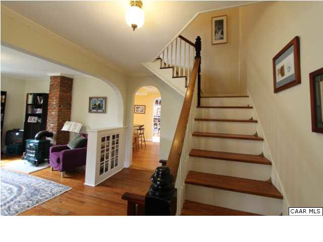 129 Goodman Street Charlottesville, VA 22902 - Photo 5 of 25 a living room with furniture and wooden floor