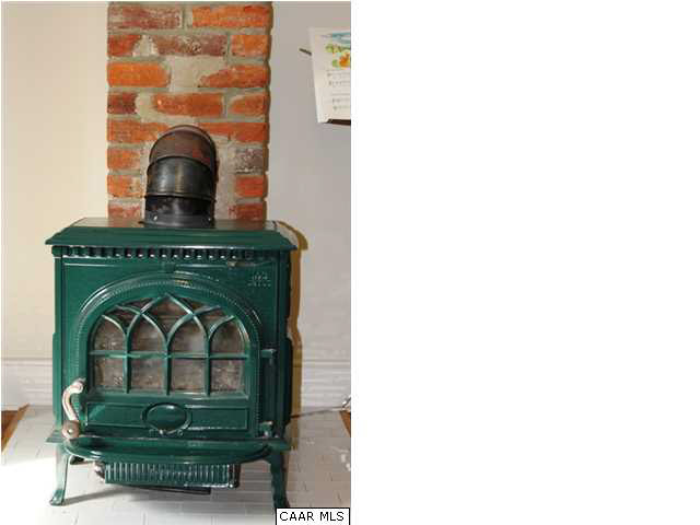 129 Goodman Street Charlottesville, VA 22902 - Photo 7 of 25 a living room with a fireplace